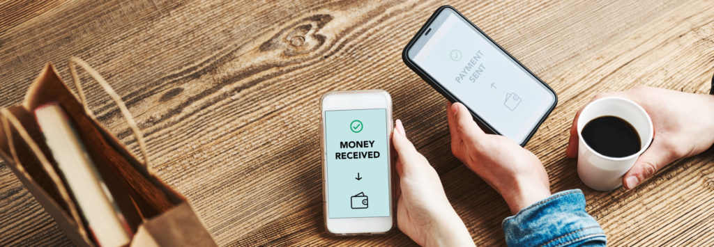 Friends transferring money using peer-to-peer digital payments.